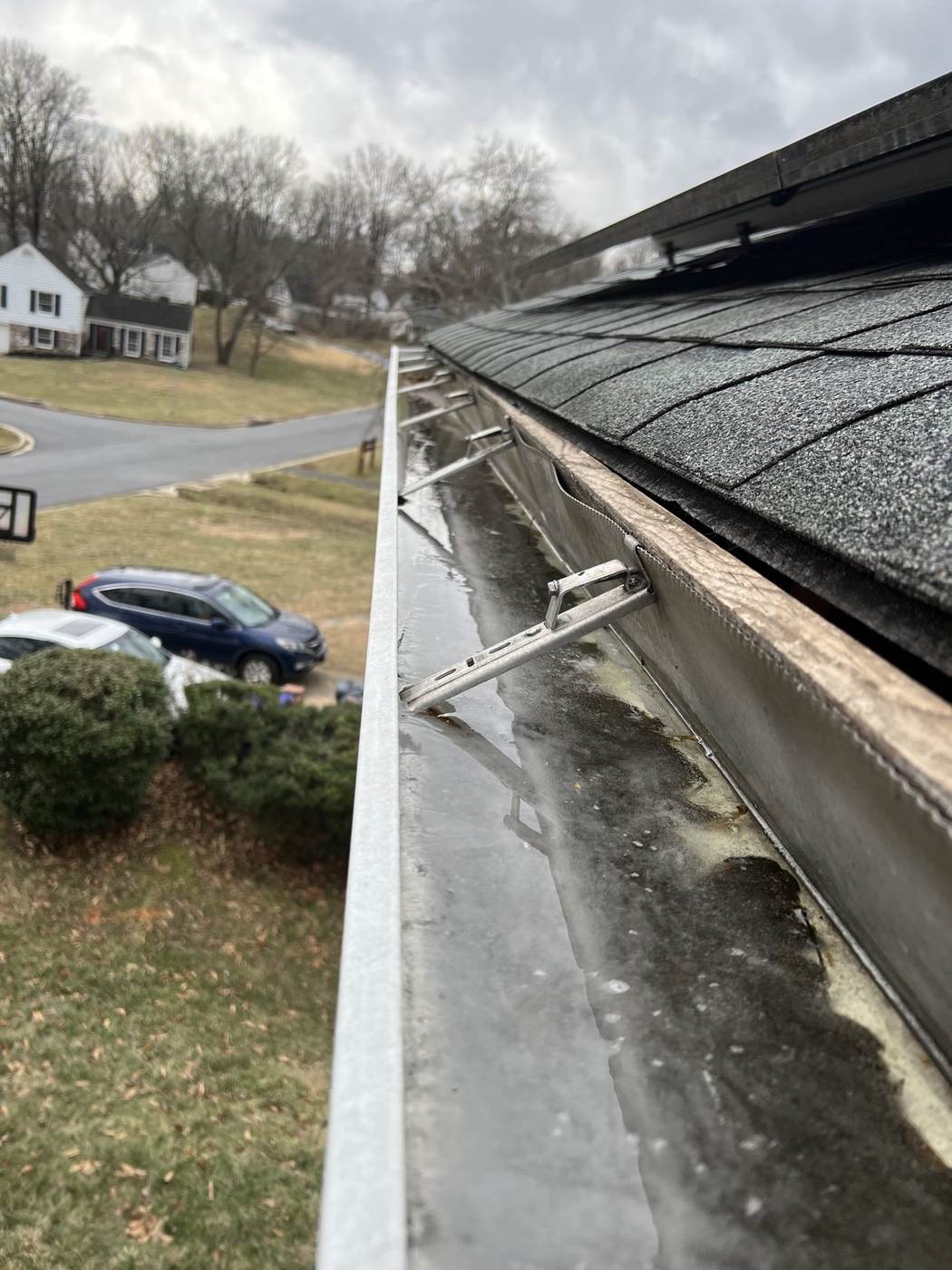 Gutter on hangers with ice
