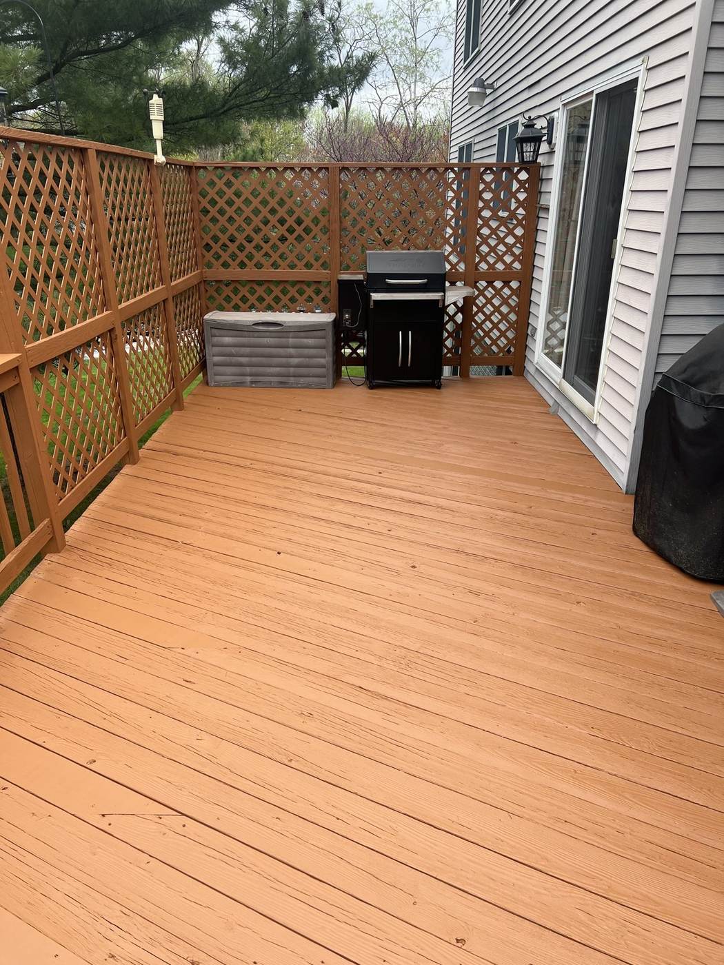 Freshly stained deck with lattice railing