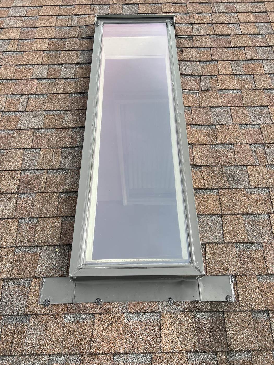 Skylight flashing repaired up close — skylight perimeter leaks are frequent repair calls in the Baltimore area.