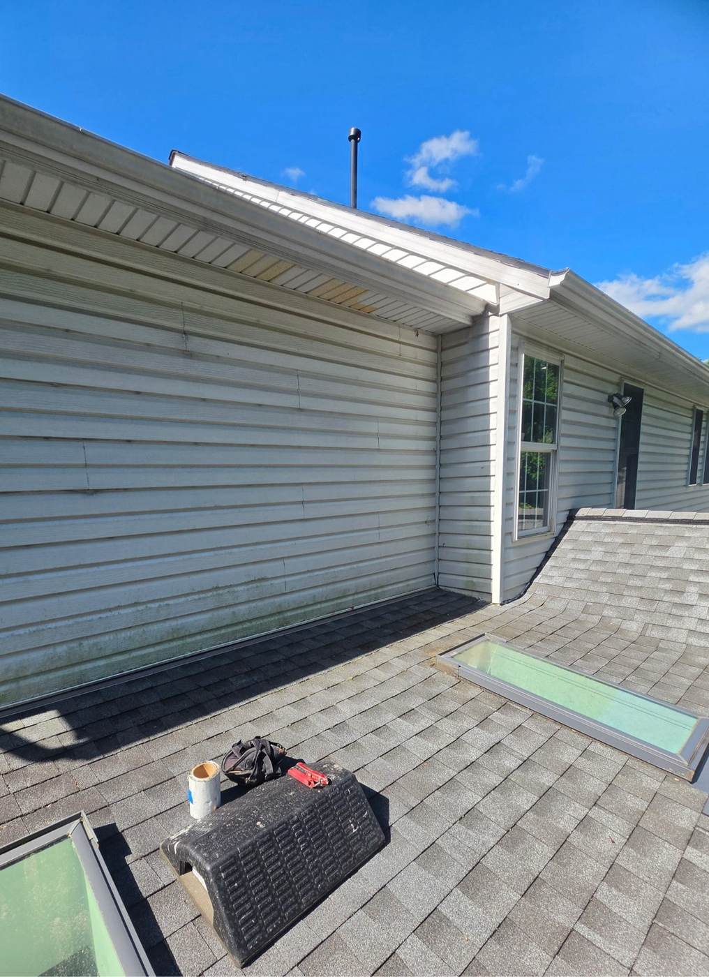 The same roof completed with new architectural shingles.